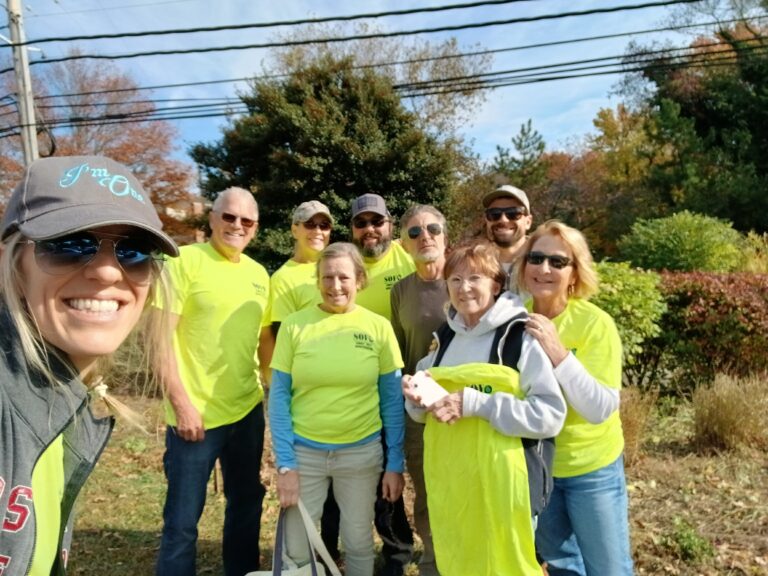 SOFO volunteers participating in a community cleanup and beautification project.