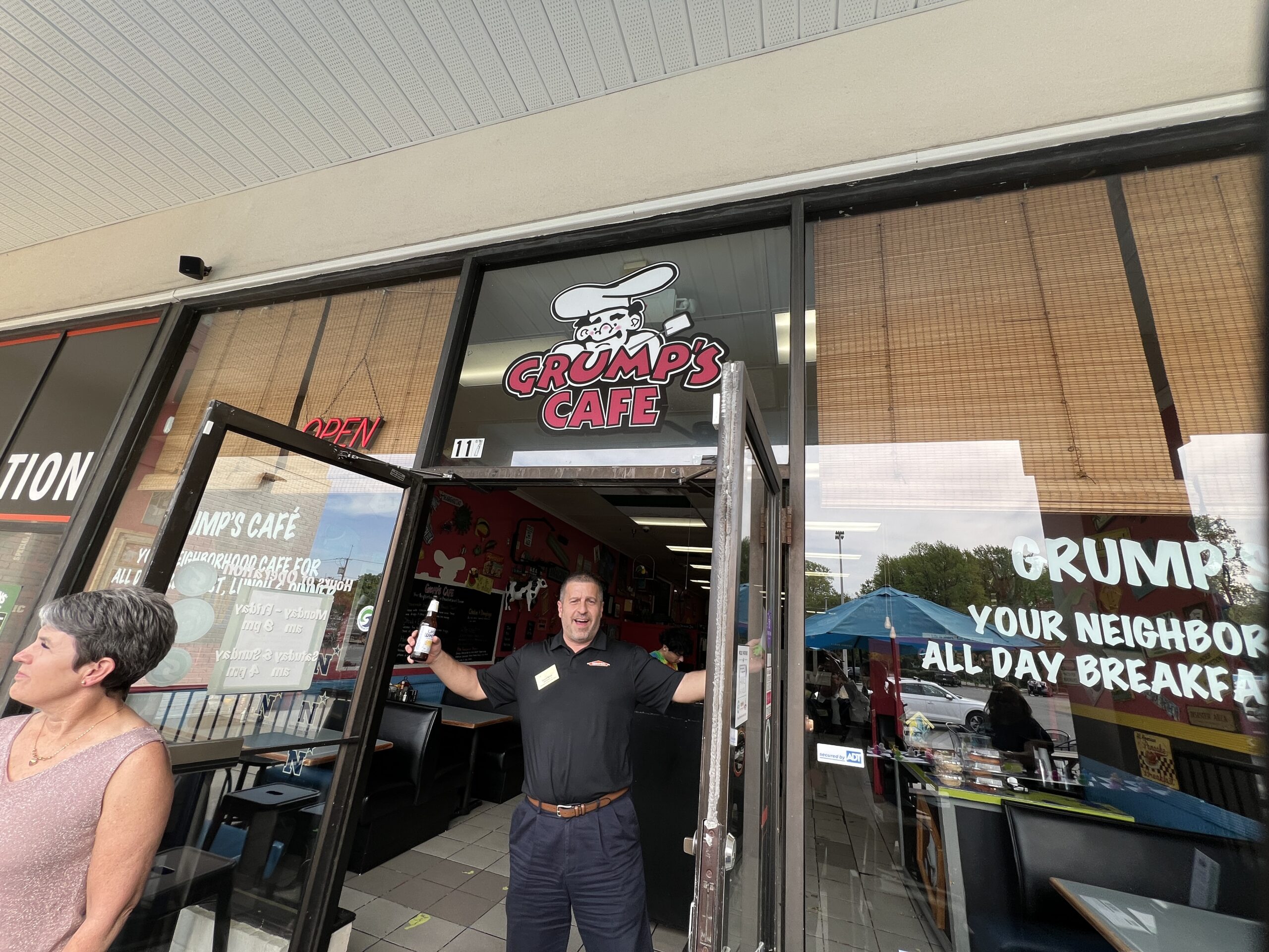 Grump's Cafe Business owner standing outside a local Annapolis business.