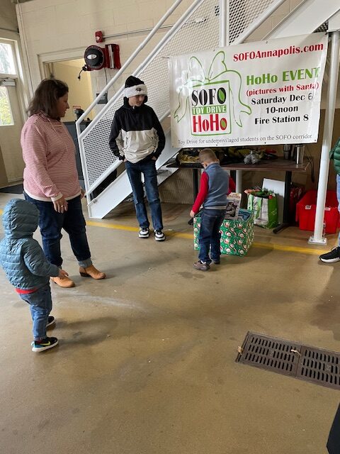 Families participating in a SOFO holiday donation event.
